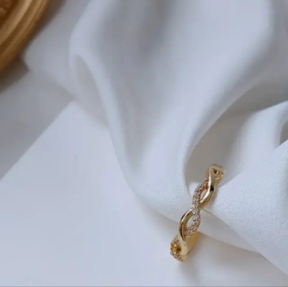 Dainty 14k Gold and Simulated Diamonds CZ Twist Ring